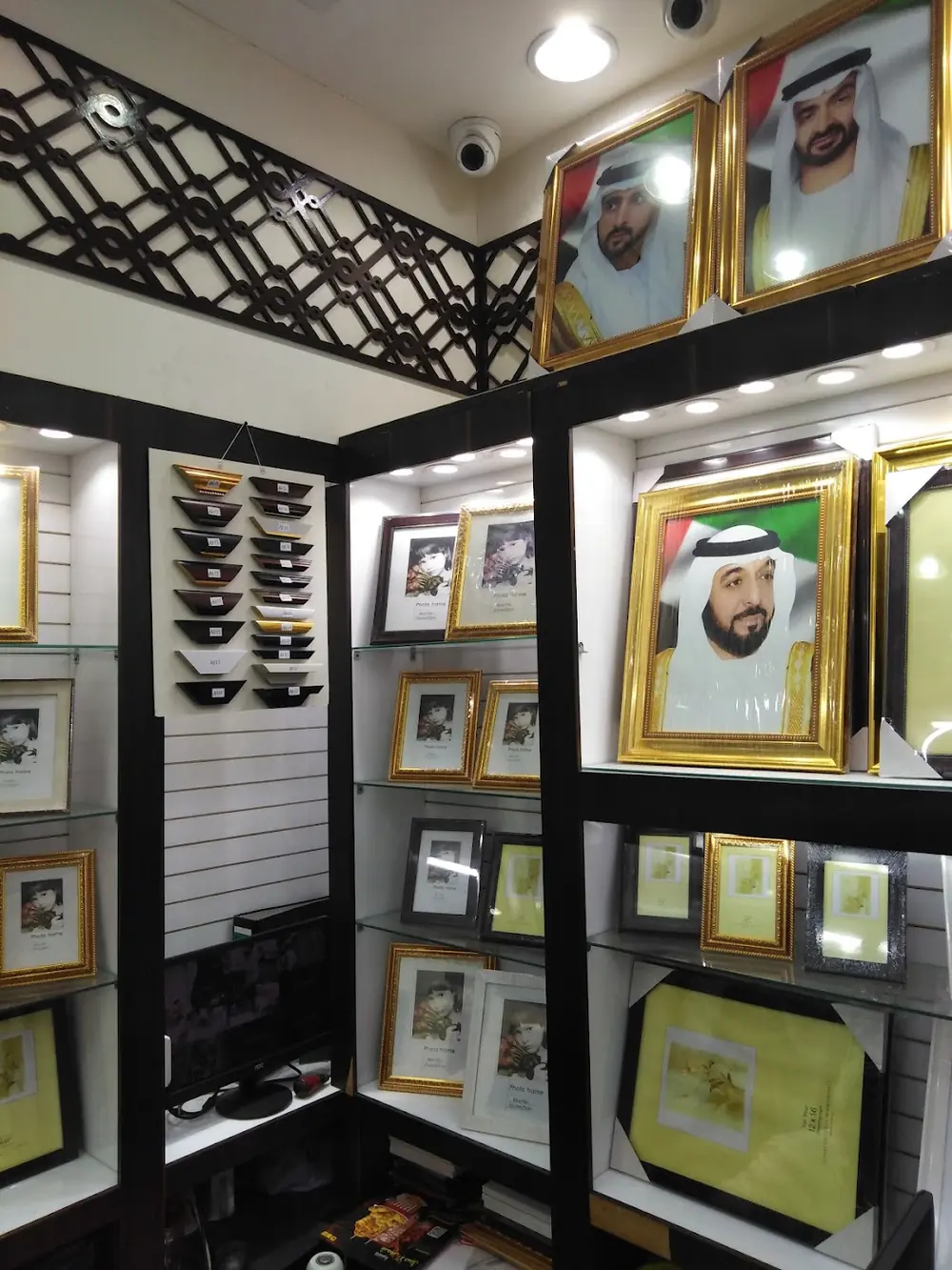 Wall of photo frames on display inside the studio